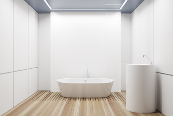 Fototapeta na wymiar White tiled bathroom, white tub