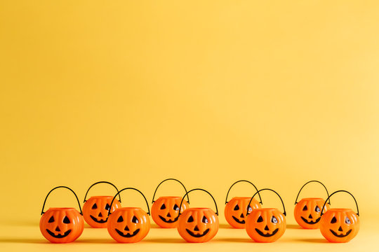 Halloween Pumpkin Decorations On A Yellow-orange Background