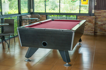 Empty  red pool table, entertainment indoor.