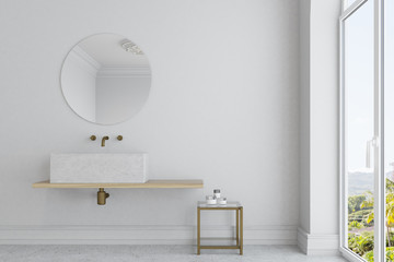 White bathroom, marble sink and mirror