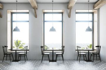 White cafe interior black tables