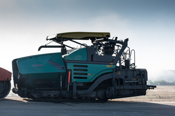 Fototapeta na wymiar Image of asphalt spreader machine with blue color,