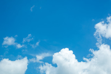 Amazing fluffy soft white clouds in bottom with copy space blue sky in day time light, ideal use for background.