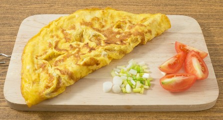 Thai Omelette with Tomatoes and Scallion on Cutting Board