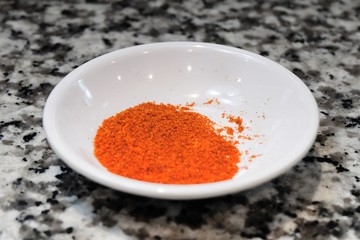 Paprika Powder in White Bowl on Table