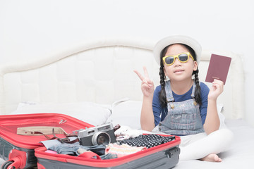 cute girl show passport with travel accessories costumes.