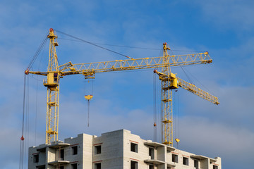 tower crane at a construction site on a Sunny day