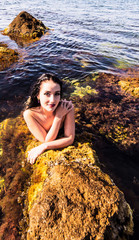 Sexy brunette on a beach