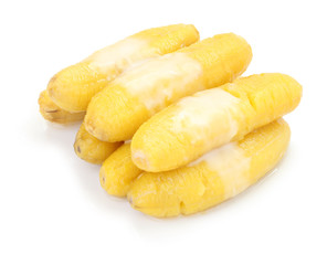 Pile of sweet dessert banana on white floor.