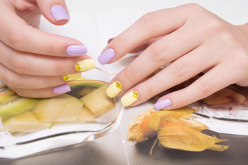 Natural nails with gel polish applied. Ideal manicure and women's hands.