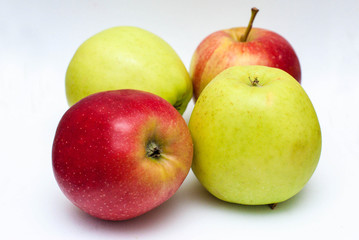 green and red apple on gray background