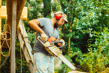 a man is sawing a log with a saw