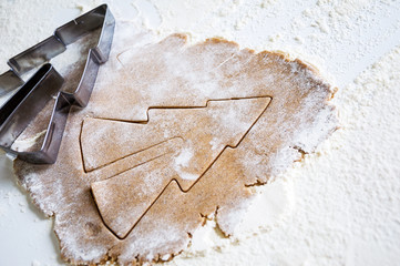 Christmas baking ingredients and tolls for dough preparation.