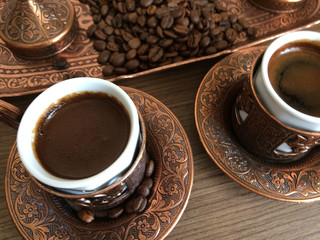 coffee cups on a wooden floor.enjoy
