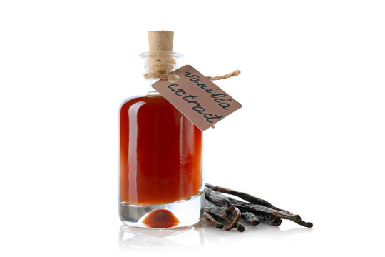 Bottle With Vanilla Extract And Sticks On White Background