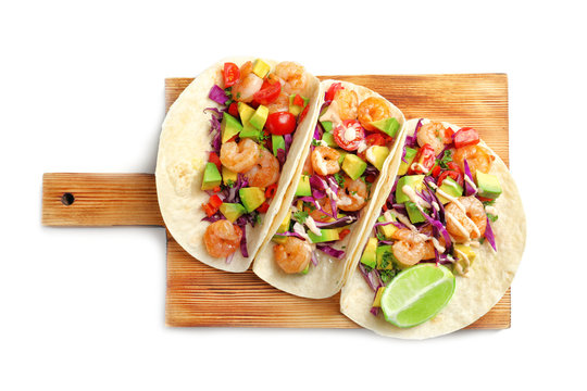 Wooden board with delicious shrimp tacos, isolated on white