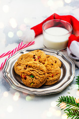 Cookies and milk for Santa on white snow background. Space for text