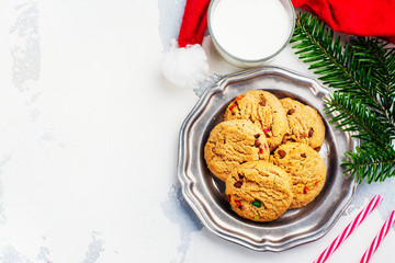 Cookies and milk for Santa on white snow background. Space for text