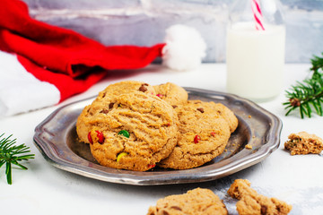 Cookies and milk for Santa on white snow background. Space for text