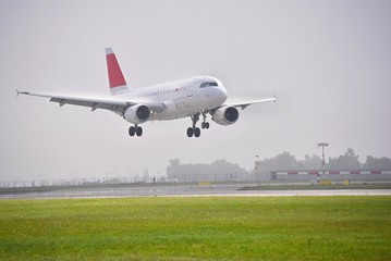 Fototapeta na wymiar Airplane on the runway. Landing - take off at the airport