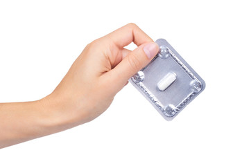 Capsules pills in hand isolated on white background