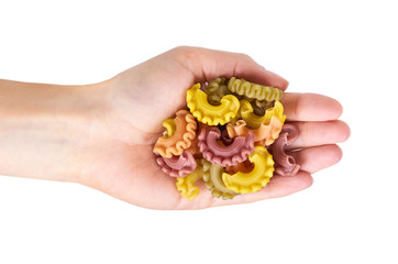 Pasta spiral in hand isolated on white background