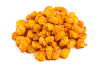 Pile of roasted spiced corn kernels isolated on a white background