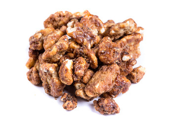 Pile of sugar coated pecans isolated on a white background