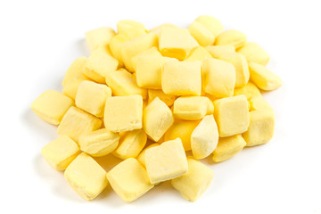 Pile of yellow mints isolated on a white background