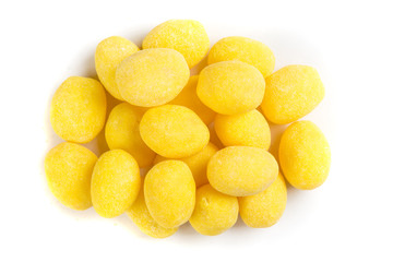 Pile of lemon candies isolated on a white background