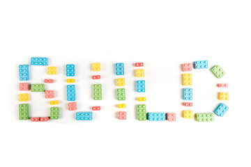 Word build made of multicolored building blocks  isolated on a white background