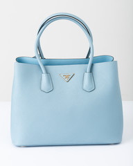 The blue leather handbag