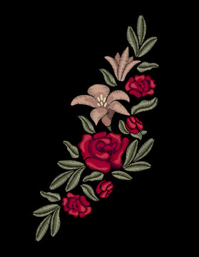 Embroidery. Lilies and red roses.