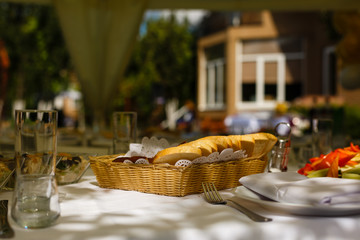 Pieces of white bread in a basket on a table