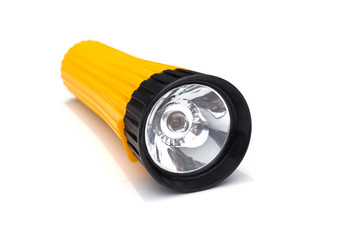 yellow electric flashlight with simple design isolate on white background