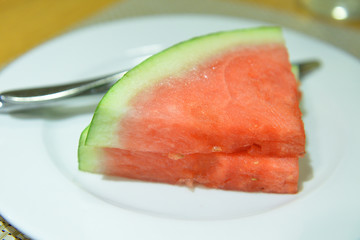 Piece of ripe watermelon on white plate