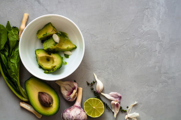 Set of ingredients for the preparation of Mexican guacamole sauce, top view, copyspace