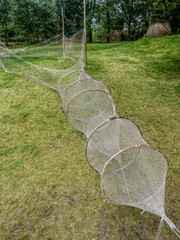 Old fishnets in heritage park in Kluki, Poland