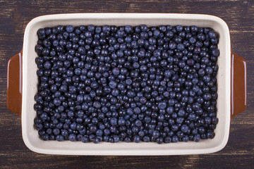 Fresh, ripe blueberries background, wild berryin ceramic ware