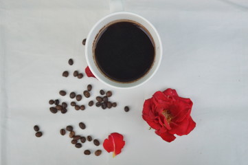A cup of coffee with a flower