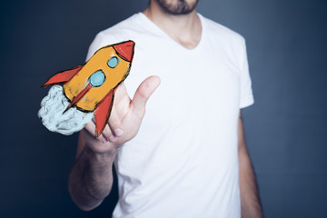 Businessman  hand red  rocket