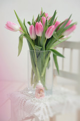 a bouquet of pink tulips in a vase