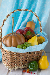 Homegrown still life of autumn harvest - pumpkin, pear, bell pepper, grape, tomato
