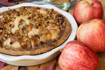 Closeup of a Whole Apple Walnut Pie in a Baking Dish