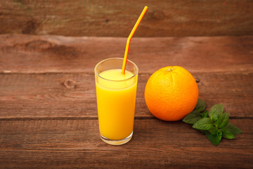 Fresh orange juice in a glass. Space for text