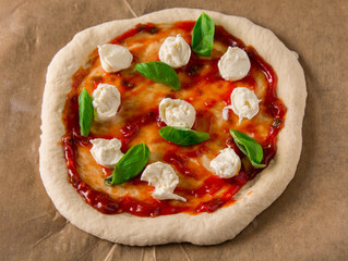 Organic Homemade Margarita Pizza with Basil and Mozarella.