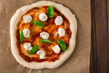 Organic Homemade Margarita Pizza with Basil and Mozarella.