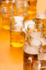 Mug of beer on wooden background