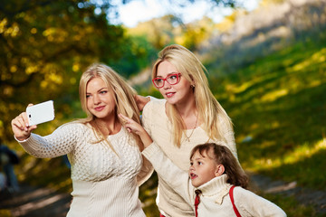 Family selfie in park