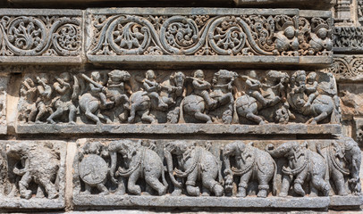 Mysore, India - October 27, 2013: Series of three friezes on outside wall of central shrine, called Trikuta, at Chennakesave temple in somanathpur.
Warriors on horses, elephants, decorative.